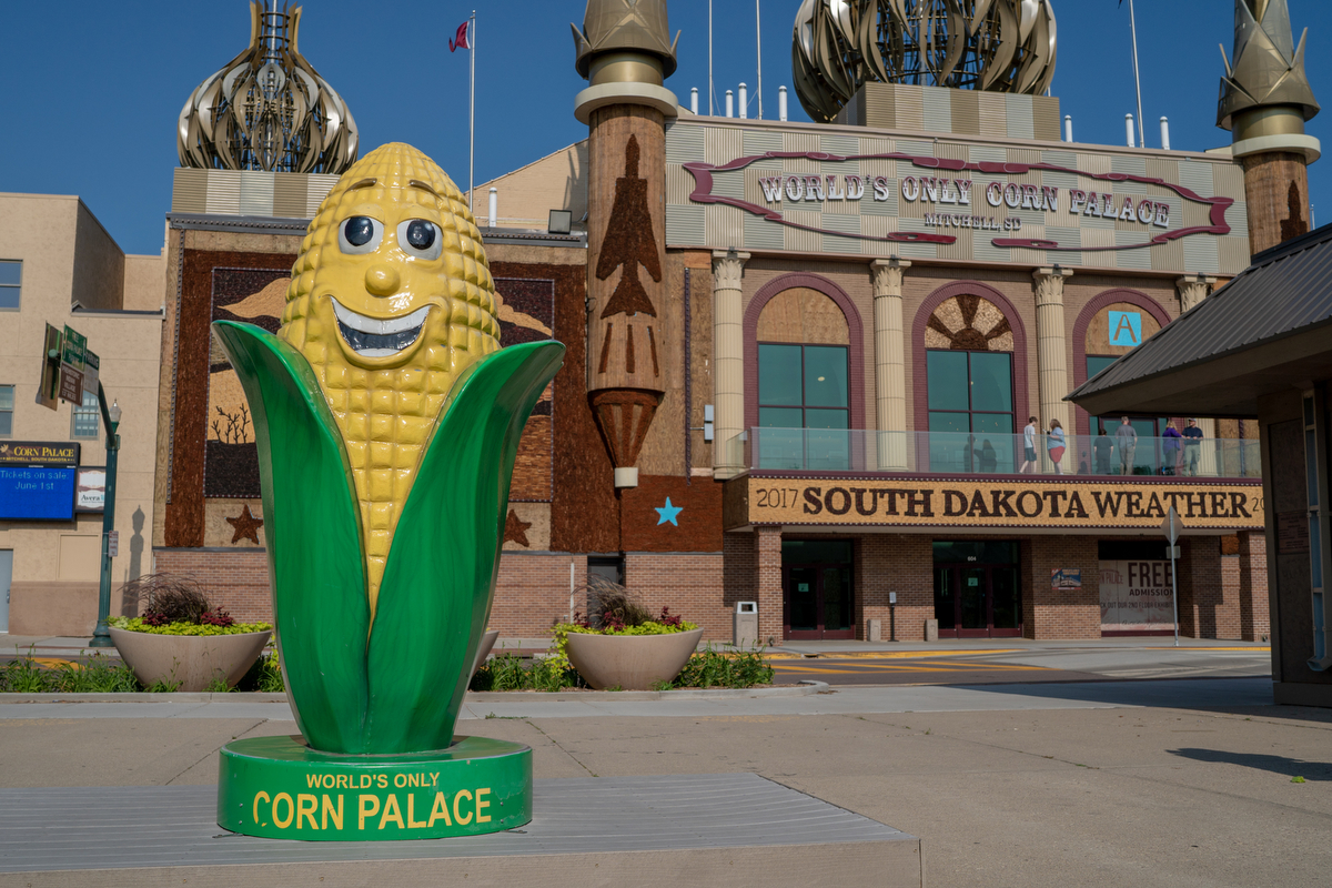 The Corn Palace in Mitchell, South Dakota, adorned with onion domes and ears of corn, attracts around half a million people a year. The exterior murals change every year with a different theme. For 2017, the theme was “South Dakota Weather.”