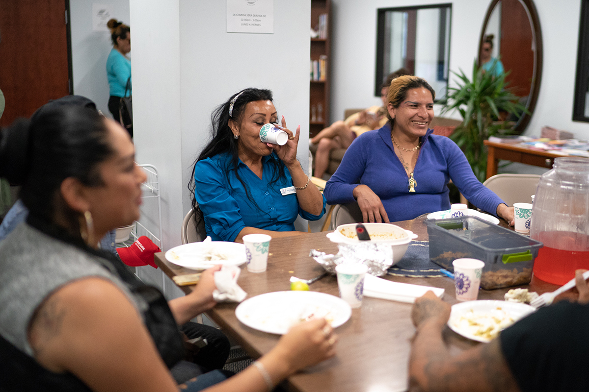 Clients of the TransLatin@ Coalition in Los Angeles eat lunch in the coalition's building. News21's investigation found that Latinos and LGBTQ people are hesitant to report hate crimes, in part because they mistrust police. (Angel Mendoza/News21)