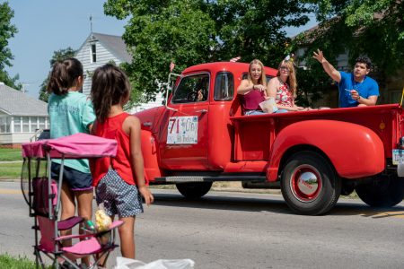 A parade consisting of small-business owners, first responders, church groups and citizens marched through Perry, Iowa, for an Independence Day celebration, passing candy out to the kids on both sides of Wills Avenue. (Lenny Martinez Dominguez/News21)