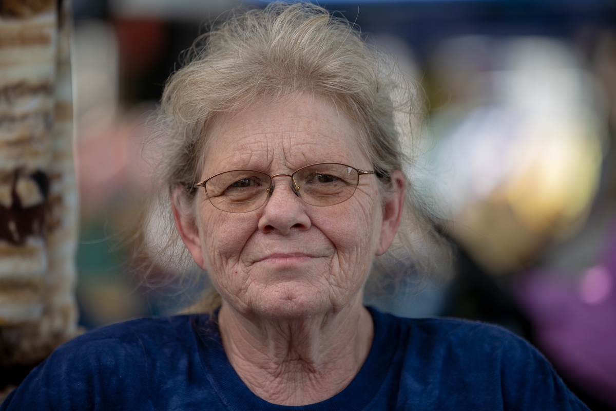 Connie Metzler, sells jewelry at Pattee Park in Perry, Iowa, during the Fourth of July celebration. She was critical of the media's coverage of politics. (Alex Lancial/News21)
