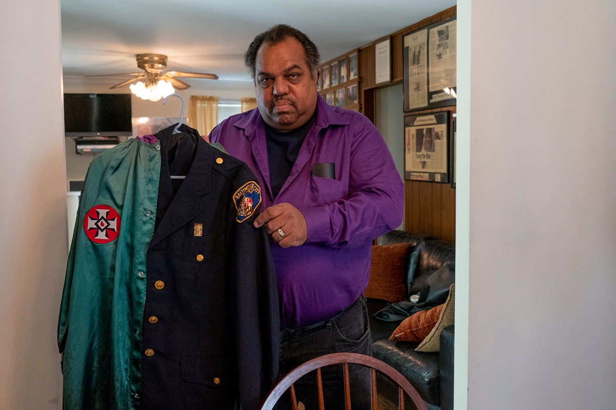 Daryl Davis collects robes belonging to members who have left the Klan. His collection includes a robe and uniform jacket that belonged to an officer of the Baltimore Police Department. (Tilly Marlatt/News21)