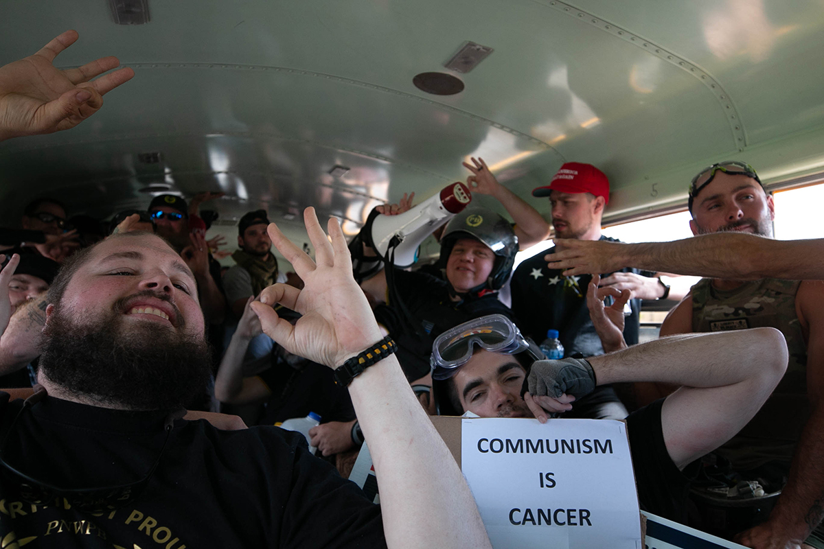 Members of the right-wing activist group Proud Boys ride their bus to a rally and march on the streets of Portland, Oregon. The Proud Boys call themselves 