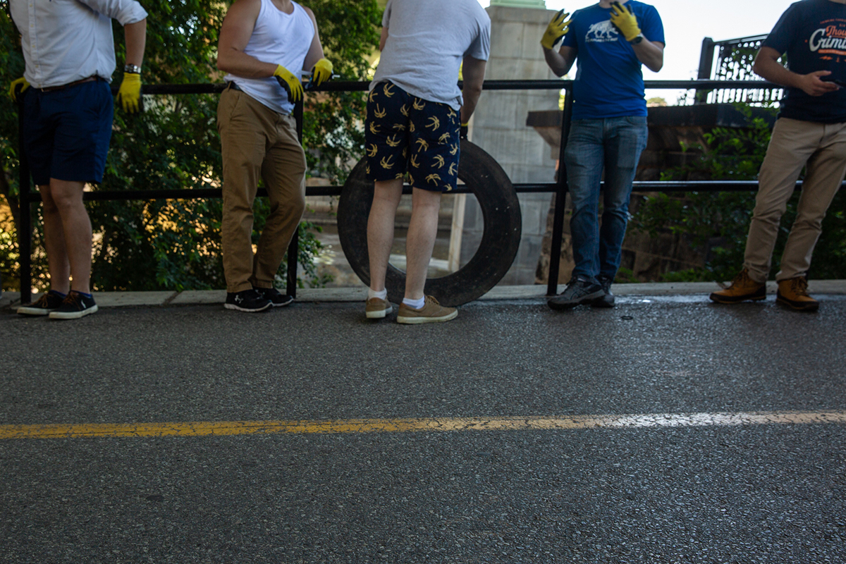 Members of Identity Evropa pick up trash in Fairmount Park in Philadelphia in early July. The park cleanup was an exercise in public relations, a way to push Identity Evropa’s ideas into the mainstream by being seen as valued members of society. “Just doing our bit for the community,” they said to a young woman with two children at her side. (Shelby Knowles/News21)
