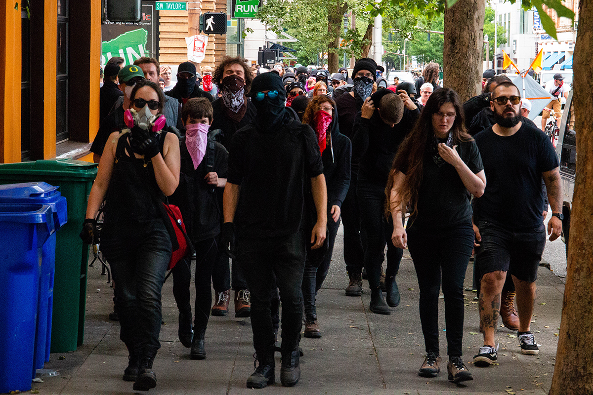 Anitfa activists march to intercept Patriot Prayer and Proud Boys for a skirmish in Portland's streets following Patriot Prayer's rally on June 30. (Brendan Campbell/News21)