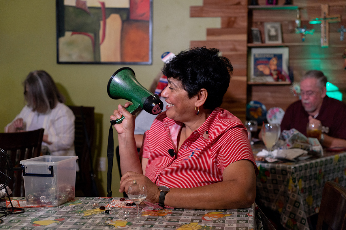 Mercedes Ricks uses a bullhorn to repeat bingo numbers during a drag queen bingo event at her restaurant, La Mariposa. The event serves as a bridge between the residents of Magnolia, Mississippi, and the LGBTQ community. (Ashley Hopko/News21)