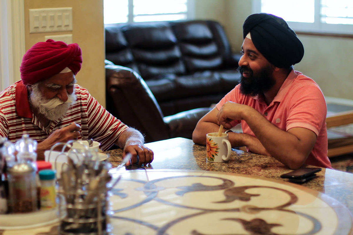 Manbir Singh (left) and his son, Balmeet Singh at their family home in Bakersfield, California. "I grew up here. I live here," Balmeet said. "I was born in America. This is our home." (Connor Murphy/News21)